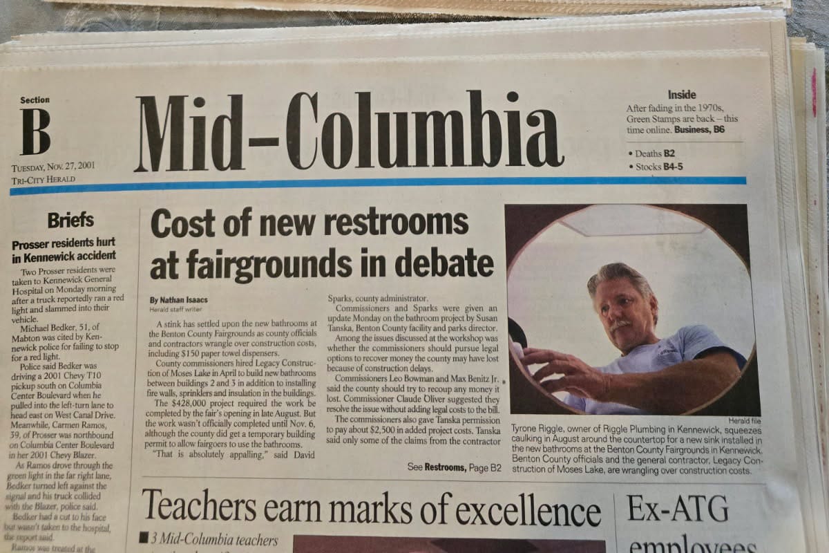 Newspaper article on fairgrounds restroom cost debate.