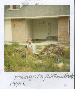 Man gardening in front of house, 1990