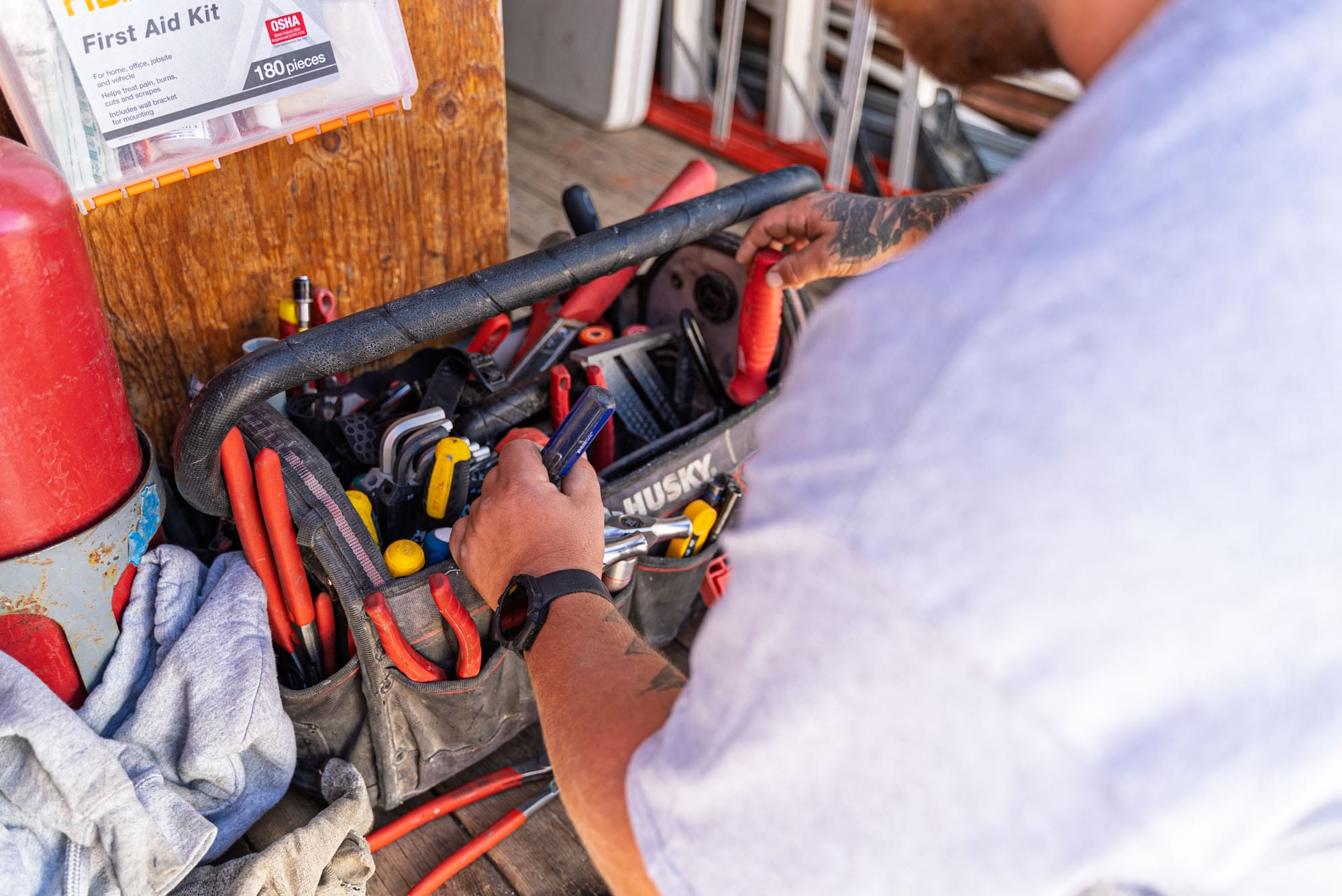 Riggle_Plumbing_0067 Man organizing tools in a toolbox