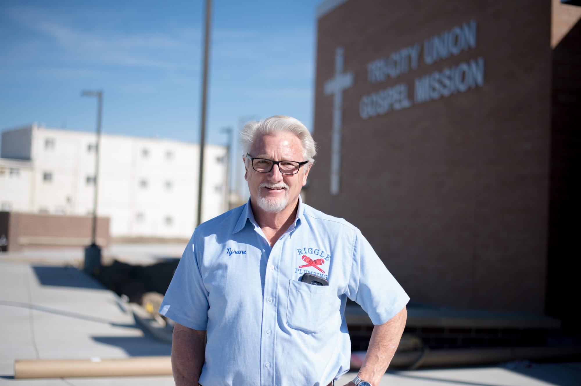 Man outside Trinity Union Gospel Mission building.